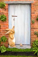 The Enchanting World of Peter Rabbit Herb Garden in the Grand Pavilion: Peter rabbit and mouse at doorway. 2014 RHS Chelsea Flower Show