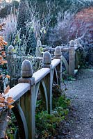 Winter garden in frost - beautiful oak finials on balustrades in the yew walk