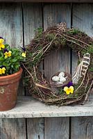 Easter wreath with nest and violas