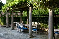Recreation of Italianate loggia with grape vines and shaded seating Seend, Wiltshire