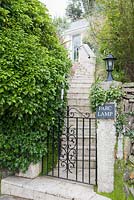 The garden and house are accessed by a steep flight of steps. Parc-Lamp, Ruan Lanihorne, Truro, Cornwall, UK