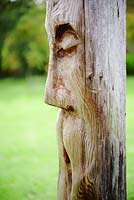 Wooden face sculpture at Sculptureheaven sculpture garden, Rhydlewis, Llandysul, Wales, UK.