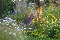 Naturalistic grasses and perennials including Hemerocallis and Kniphofia - The Jordans Wildlife Garden, RHS Hampton Court Flower Show 2014
