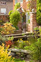 The pond towards the garden gate. Hope House Garden, Caistor, Lincolnshire, UK. April 2014.