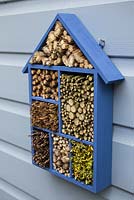 Insect house mounted on the side of a shed