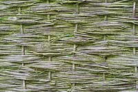 Aged and weathered willow weave screen fences