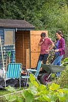 Tidying and organising a small allotment shed that's not really large enough for all your gardening tools and equipment