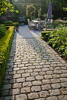 Granite setts path to the dinning area on patio.
