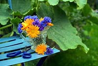 Cut garden flowers - marigolds and cornflowers