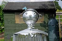 The Tin Man Scarecrow from The Wizard of Oz with colanders for hat, Paddock Allotments 
