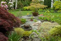 Dry gravel garden with central water feature. Victoria BC, Canada