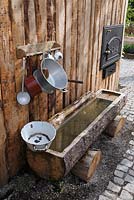 Wooden fountain in alpine style with washbowl, Sigmaringen, Germany