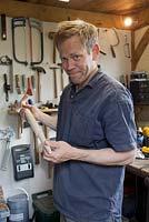 Piers busy in his workshop making a new handle for an antique restored tool
