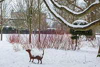 Sculpture of a dog in snow, the Stumpery, Highgrove Garden, January 2013. 