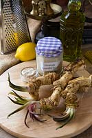 Home made horseradish sauce, with horseradish  roots - Armoracia rusticana- and basic ingredients.