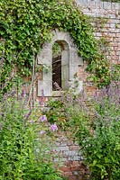 Window through wall of kitchen garden