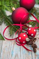 Red polkadot baubles with Ribbon, alder cones and yew foliage