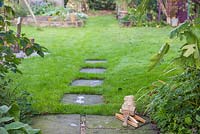 Existing stone slab path leading through garden. 