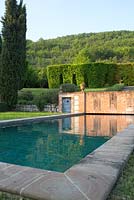 The swimming pool in the garden at Domaine de Chatelus de Vialar.
