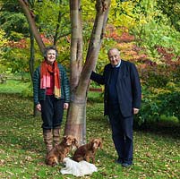 Lawrence and Elizabeth Banks with their three dogs, in the Maple Grove which they have planted in the last 30 years.