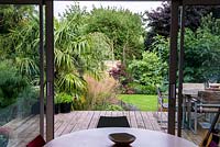 The view from the kitchen of St. Mary's walk, a 30' x 15' terraced garden on a sloping site.
