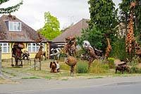 Metal animal sculptures in the front garden of a house at Histon near Cambridge. Folk art.