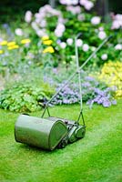 Vintage hand pushed cylinder mower with grassbox made by JP Lawnmowers
