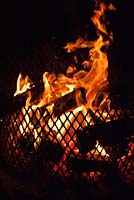 Logs burning in garden fire pit 