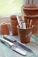 Vintage flower pots with knives and dibbers