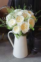Cream roses in an arrangement. Rose 'Patience' a cut flower variety from David Austin Roses