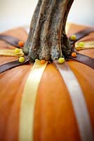 Decorating pumpkin - all ribbons in place with pins 