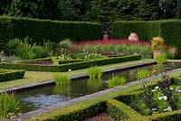 The Pool Garden at Abbeywood. A long reflecting pool is surrounded by formal box borders.