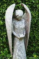 Wooden angel carved by John Aulman. Caervallack Farm, nr Helston, Cornwall, UK