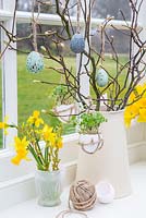 Egg Shell Cress hanging in a rustic string satchel, amongst an Easter setting. 
