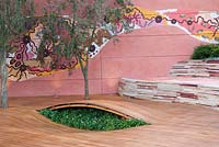 Tree planted in hardwood decking, mosaic wall and seating - Flemings and Trailfinders Australian Garden - Design - Jamie Durie, Sponsor - Flemings Nurseries and Trailfinders, Chelsea Flower Show 2008 - Gold Medal Winner