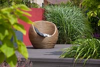 Terrace surrounded by ornamental grasses.