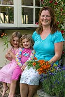 Jo Wright, the driving force behind Organic Blooms, takes a break with her two little girls.