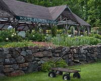 White Flower Farm lathe house with shopping wagon in front