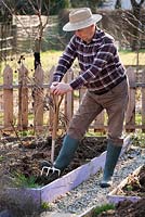 Early spring preparation of vegetable beds. Forking.