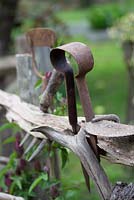 Vintage, garden tools displayed on rustic fence