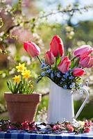 Floral arrangements of tulips, forget-me-nots and daffodils.