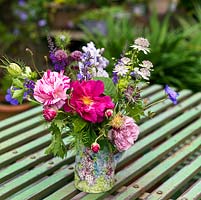 A home grown floral arrangement with roses, Astrantia and Nigella.