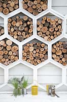 Shed wall covered with hexagonal insect habitats - The Bees Knees in support of The Bumblebee Conservation Trust - RHS Malvern Spring Festival 2015