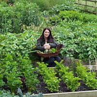 Rachel de Thame harvesting produce from her country vegetable garden.