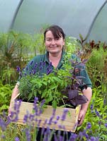 Anne Marie Owens, head gardener at Le Manoir, with a box of fresh herbs and flowers grown in the kitchen garden.