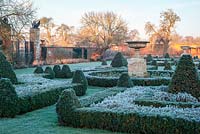 Formal box parterre with frost at Helmingham Hall, Suffolk