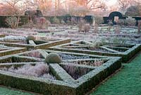 Frosted knot garden with statue of Flora at Helmingham Hall, Suffolk