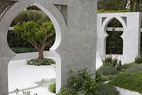 View through marble archway to Citrus auranticum. The Beauty of Islam. RHS Chelsea Flower Show 2015