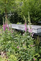 Garden bench made from slate and slate patio , Digitalis purpurea - common Foxglove  - The Brewin Dolphin Garden - RHS Chelsea Flower Show, 2015