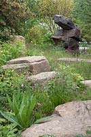 The Laurent Perrier Chatsworth Garden, featuring the naturalism of Chatsworth and the wilder side of gardening, depicting the trout stream and Paxton's rockery. RHS Chelsea Flower Show, 2015